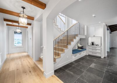 Custom wood staircase with iron railing in modern home interior